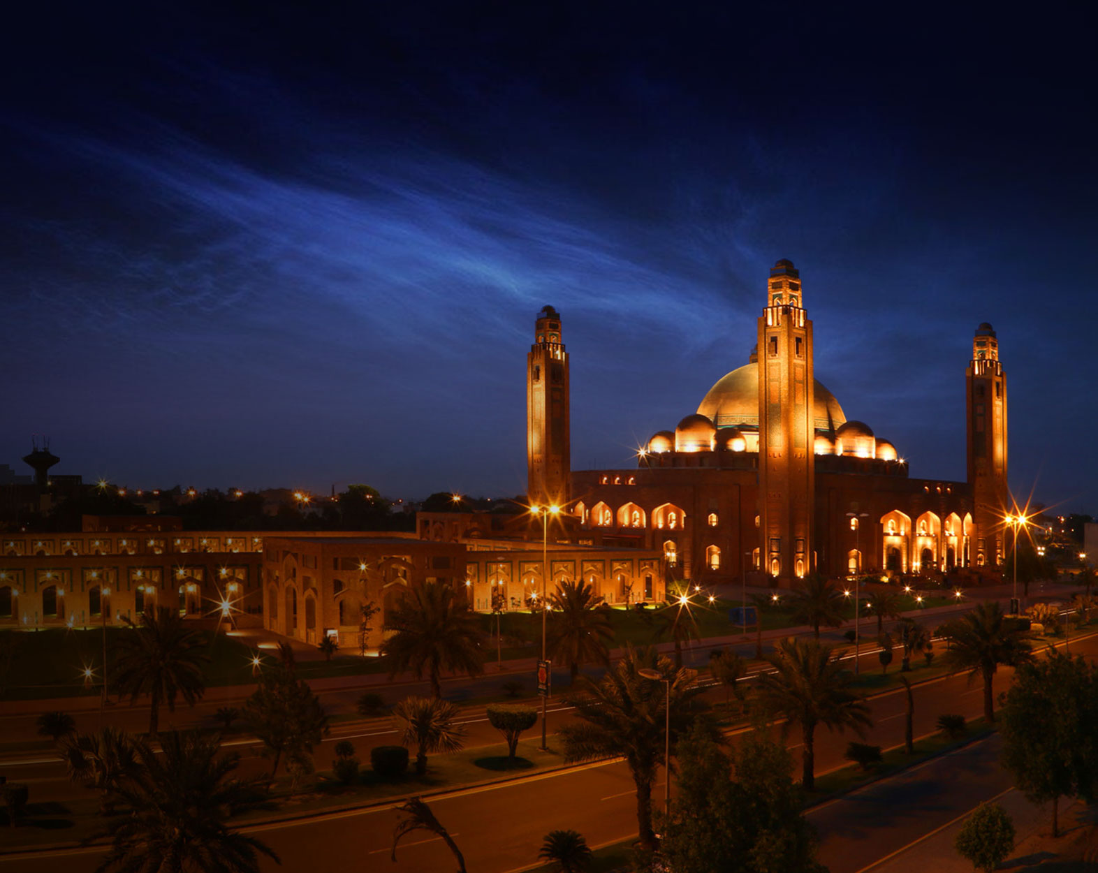 Grand Jamia Masjid illuminated at night in Bahria Town Lahore