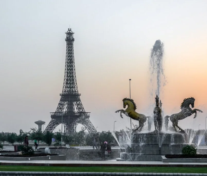 Eiffel Tower and fountain at dusk in Bahria Town Lahore